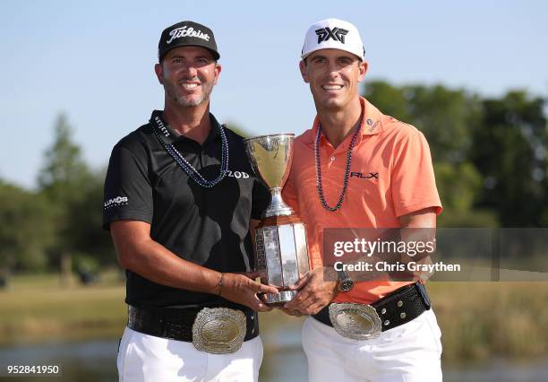 Billy Horschel and Scott Piercy pose with the trophy and commerative belts during the final round of the Zurich Classic at TPC Louisiana on April 29,...