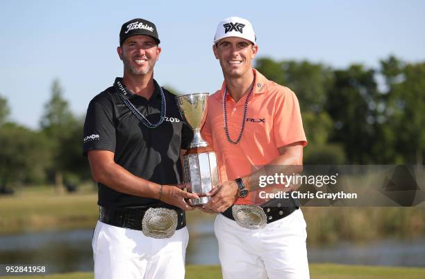 Billy Horschel and Scott Piercy pose with the trophy and commerative belts during the final round of the Zurich Classic at TPC Louisiana on April 29,...