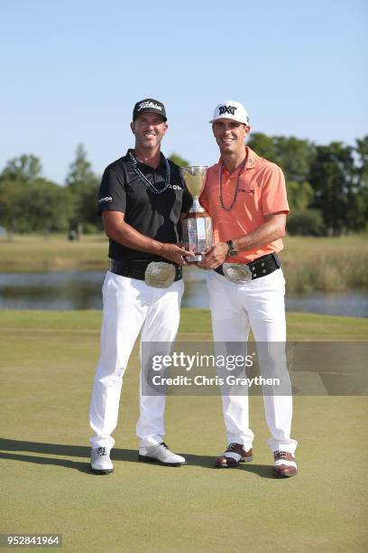 Billy Horschel and Scott Piercy pose with the trophy and commerative belts during the final round of the Zurich Classic at TPC Louisiana on April 29,...