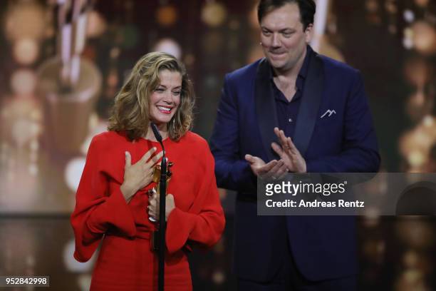 Marie Baeumer accepts the award 'Best Actress' for the movie '3 Tage in Quiberon' next to laudator Charly Huebner on stage during the Lola - German...