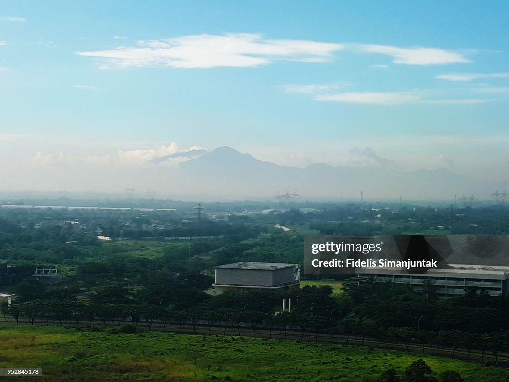 Tangerang city aerial view with mountain range in the background