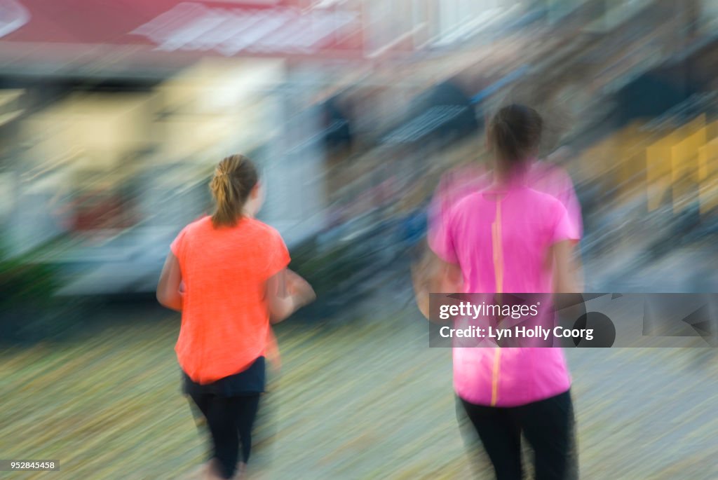 Blurred image of two female joggers