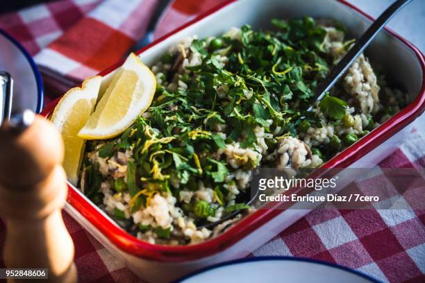 mushroom, pea and lemon risotto - italian parsley stock pictures, royalty-free photos & images