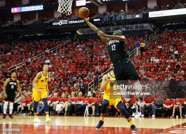 Luc Mbah a Moute of the Houston Rockets goes up for a lay up defended by Raul Neto of the Utah Jazz in the second half during Game One of the Western...