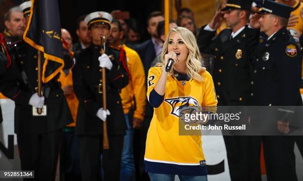 Country artist and wife of Mike Fisher of the Nashville Predators Carrie Underwood sings the National Anthem prior to Game Two of the Western...