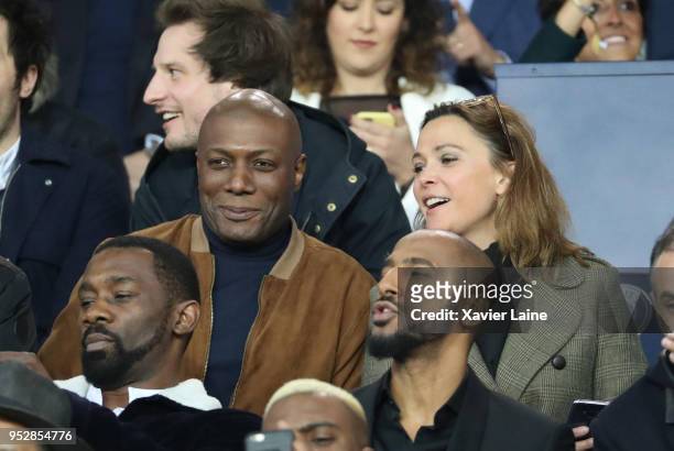Harry Roselmack and Sandrine Quetier attend the Ligue 1 match between Paris Saint Germain and EA Guingamp at Parc des Princes on April 29, 2018 in...