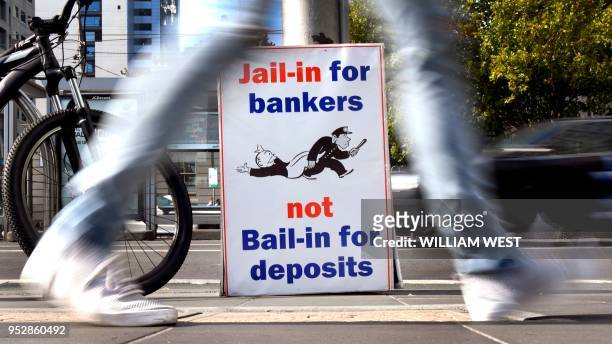 Photo taken in Melbourne on April 23, 2018 show placards outside the royal commission set up in February to investigate misconduct in the banking...