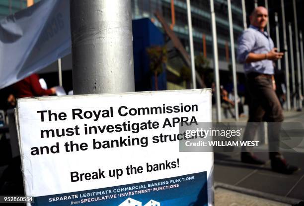 Photo taken in Melbourne on April 23, 2018 show a placard outside the royal commission set up in February to investigate misconduct in the banking...