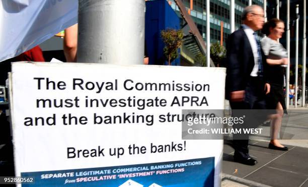Photo taken in Melbourne on April 23, 2018 show a placard outside the royal commission set up in February to investigate misconduct in the banking...