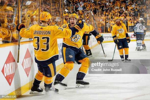 Viktor Arvidsson celebrates his goal with Filip Forsberg of the Nashville Predators against the Winnipeg Jets in Game Two of the Western Conference...