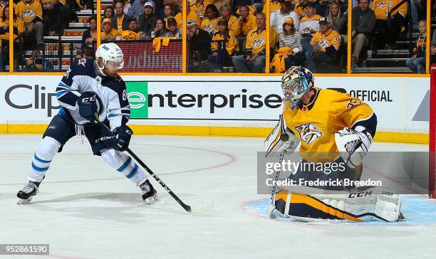 Goalie Pekka Rinne of the Nashville Predators makes a save on a shot by Kyle Connor of the Winnipeg Jets during the second period in Game Two of the...