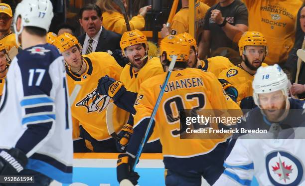 Ryan Johansen of the Nashville Predators is congratulated by teammates Kyle Turris and Mike Fisher after scoring a goal against the Winnipeg Jets...