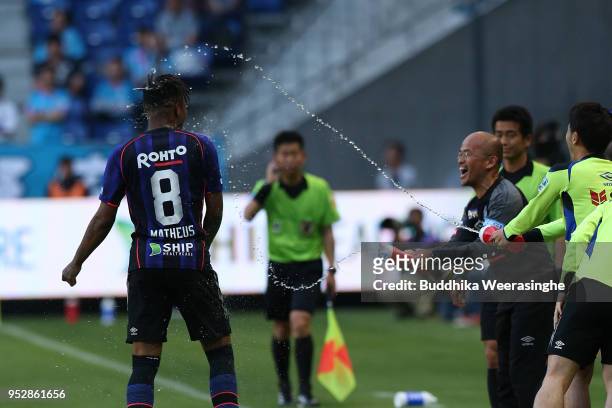 Matheus of Gamba Osaka is congratulated after scoring his side's third goal during the J.League J1 match between Gamba Osaka and Sagan Tosu at Suita...