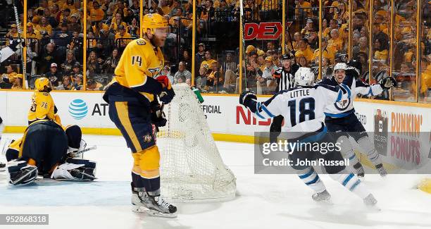 Brandon Tanev and Bryan Little of the Winnipeg Jets celebrate a goal against Mattias Ekholm of the Nashville Predators in Game Two of the Western...