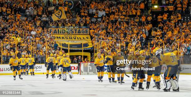 The Nashville Predators celebrate 5-4 overtime win against the Winnipeg Jets in Game Two of the Western Conference Second Round during the 2018 NHL...