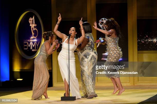 Adrienne Bailon, Tamera Mowry, Loni Love and Jeannie Mai, winners of Outstanding Entertainment Talk Show Host for 'The Real', accept award onstage...