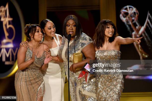 Adrienne Bailon, Tamera Mowry, Loni Love and Jeannie Mai, winners of Outstanding Entertainment Talk Show Host for 'The Real', accept award onstage...