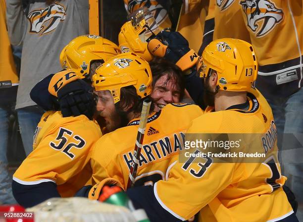 Matt Irwin, Ryan Hartman, and Nick Bonino congratulate teammate Kevin Fiala on scoring the game winning goal in the second period of overtime in a...