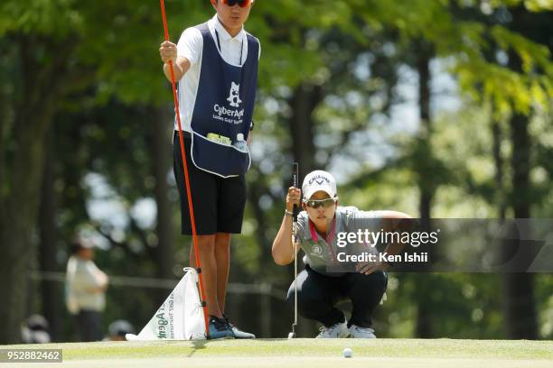 Hee-Kyung Bae of Korea reads the 15th green during the final round of the CyberAgent Ladies Golf Tournament at Grand fields Country Club on April 29,...