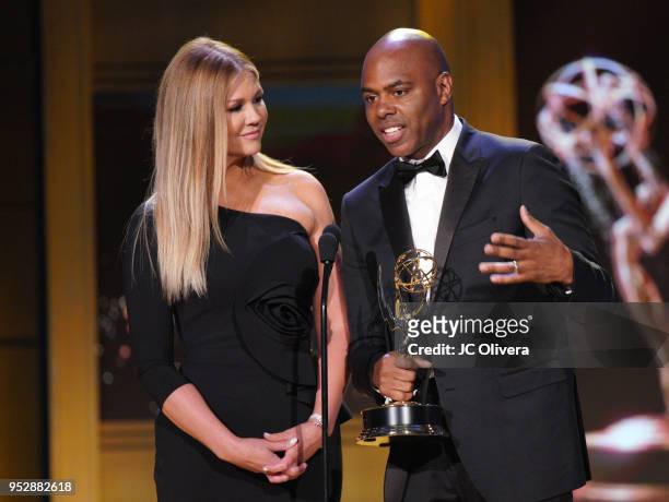 Nancy O'Dell and Kevin Frazier, winners of Outstanding Entertainment News Program for 'Entertainment Tonight', accept award onstage during the 45th...