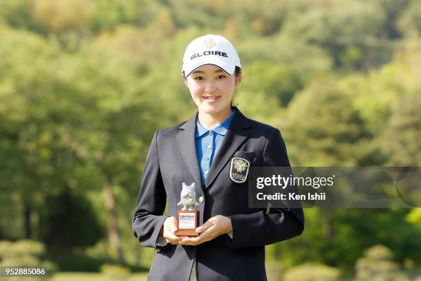 Madoka Kimura of Japan holds the trophy for the leading amateur after final round of the CyberAgent Ladies Golf Tournament at Grand fields Country...