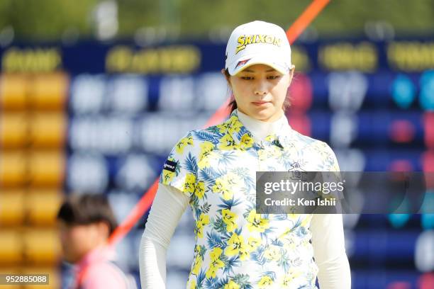 Hina Arakaki of Japan watches on the 18th green during the final round of the CyberAgent Ladies Golf Tournament at Grand fields Country Club on April...