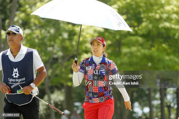 Ritsuko Ryu of Japan walks off the 15th green during the final round of the CyberAgent Ladies Golf Tournament at Grand fields Country Club on April...