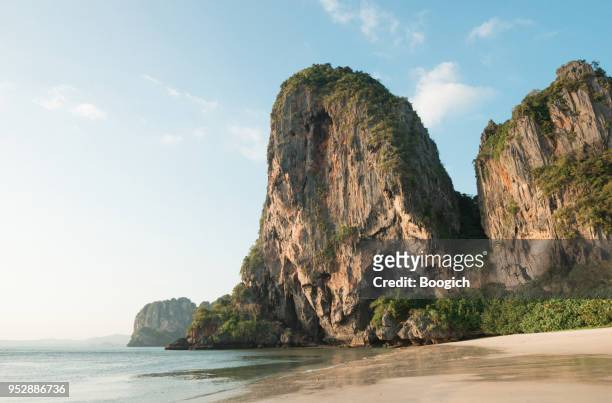 rugged coastal landscape ao phra nang beach thailand - krabi stock pictures, royalty-free photos & images