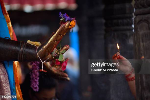 Devotee offering ritual towards Dipankar Buddha during celebration of Buddha Purnima festival, Birth Anniversary of Lord Gautam Buddha at Chiloncho,...