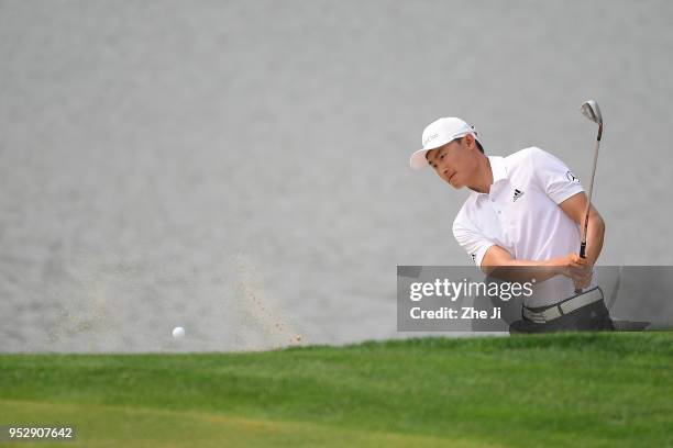 Li Haotong of China plays a shot during the final round of the 2018 Volvo China Open at Topwin Golf and Country Club on April 29, 2018 in Beijing,...