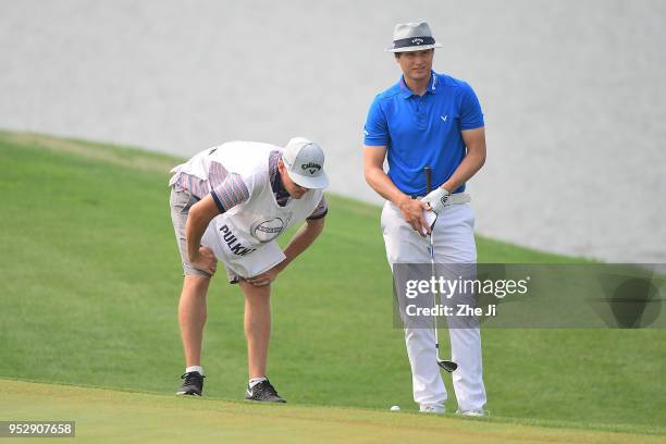 Tapio Pulkkanen of Finland plays a shot during the final round of the 2018 Volvo China Open at Topwin Golf and Country Club on April 29, 2018 in...