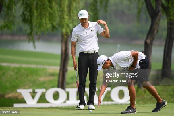 Li Haotong of China plays a shot during the final round of the 2018 Volvo China Open at Topwin Golf and Country Club on April 29, 2018 in Beijing,...