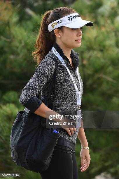 The girlfriend of Gavin Green of Malaysia watches plays a shot during the final round of the 2018 Volvo China Open at Topwin Golf and Country Club on...