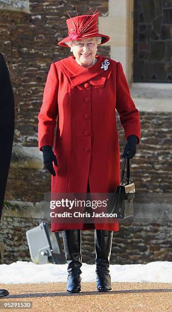 Queen Elizabeth II smiles as she leaves the Christmas Day service at Sandringham Church on December 25, 2009 in King's Lynn, England. The Royal...