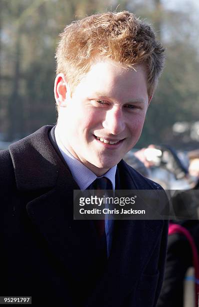 Prince Harry arrive to attend the Christmas Day service at Sandringham Church on December 25, 2009 in King's Lynn, England. The Royal Family are...