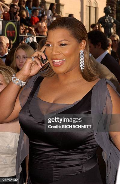 Actress Queen Latifah receives word that her new film "Bringing Down The House" had a number one weekend opening of 31.7 million, as she arrives at...