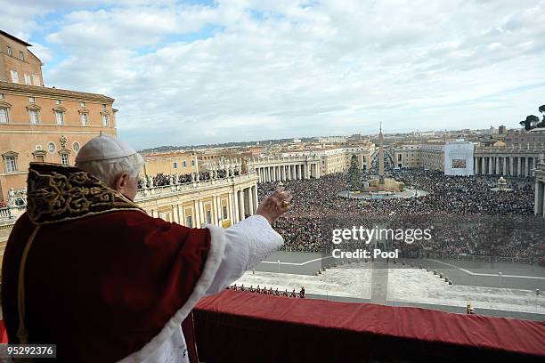 Pope Benedict XVI delivers his 'urbi et orbi' blessing from the central balcony of St Peter's Basilica on December 25, 2009 in Vatican City, Vatican.