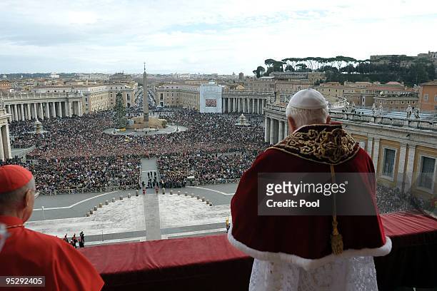 Pope Benedict XVI delivers his 'urbi et orbi' blessing from the central balcony of St Peter's Basilica on December 25, 2009 in Vatican City, Vatican.