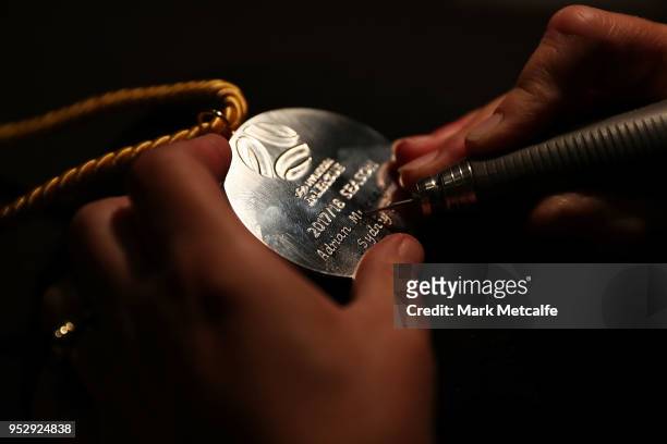 The Johnny Warren Medal is engraved with the name of the winner Adrian Mierzejewski of Sydney FC during the FFA Dolan Warren Awards at The Star on...
