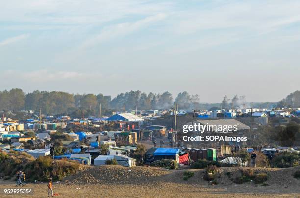 The Calais Jungle during the evacuation. The Jungle was an illegal migrant camp in the northern French town of Calais. The camp attracted migrants...