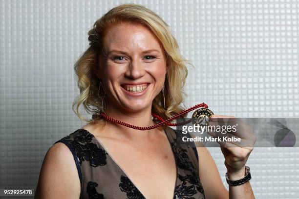 Clare Polkinghorne of the Brisbane Roar poses with the Julie Dolan Medal after being announced the joint winner with Sam Kerr of Perth Glory during...