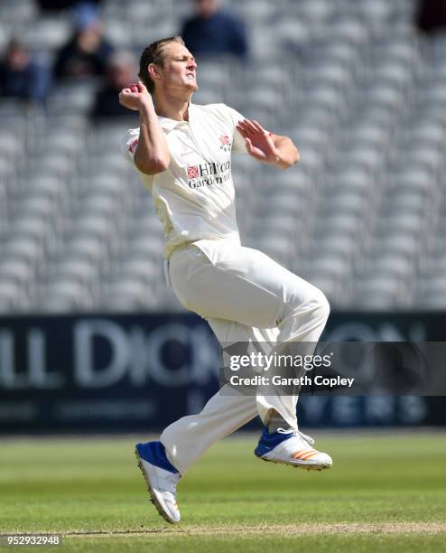 Joe Mennie of Lancashire bowls during day four of the Specsavers County Championship Division One match between Lancashire and Surrey at Old Trafford...