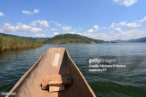 on a dugout canoe on lake bunyonyi - dugout canoe ストックフォトと画像