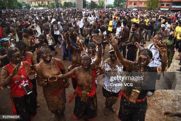 People smear each other with mud during the Monihei Carnival at Cangyuan Wa Autonomous County on April 30, 2018 in Lincang, Yunnan Province of China....