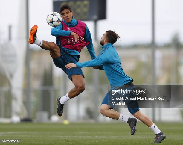 Raphael Varane and Borja Mayoral of Real Madrid in action during a training session at Valdebebas training ground on April 30, 2018 in Madrid, Spain.