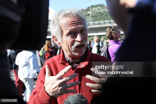European Green MP Jose Bove speaks to the press in Ventimiglia, an Italian city near the border between Italy and France, on April 30, 2018 at the...