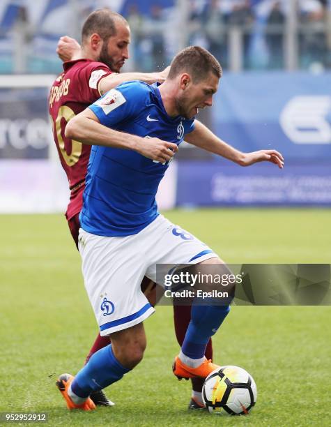 Aleksandr Tashayev of FC Dinamo Moscow and Fyodor Kudryashov of FC Rubin Kazan vie for the ball during the Russian Football League match between FC...