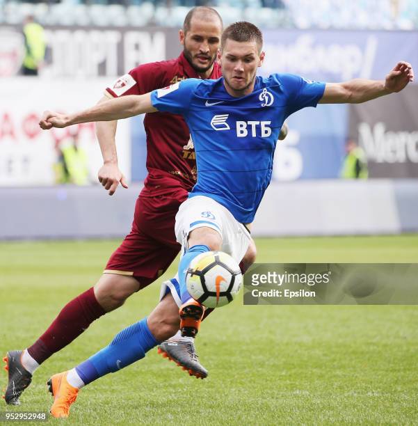 Aleksandr Tashayev of FC Dinamo Moscow and Fyodor Kudryashov of FC Rubin Kazan vie for the ball during the Russian Football League match between FC...