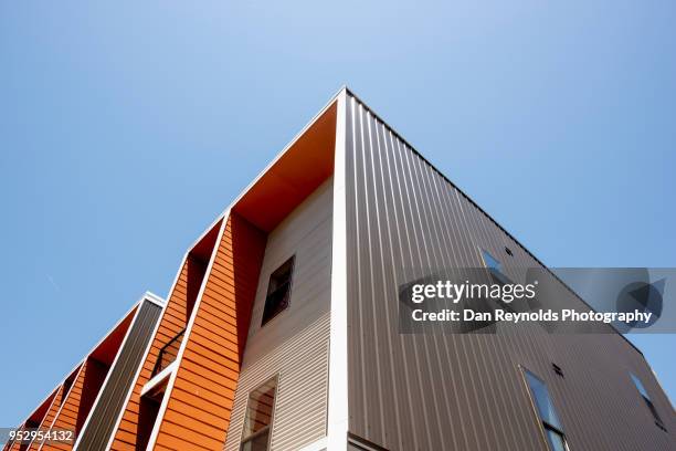 modern condominiums - modern housing development stock pictures, royalty-free photos & images