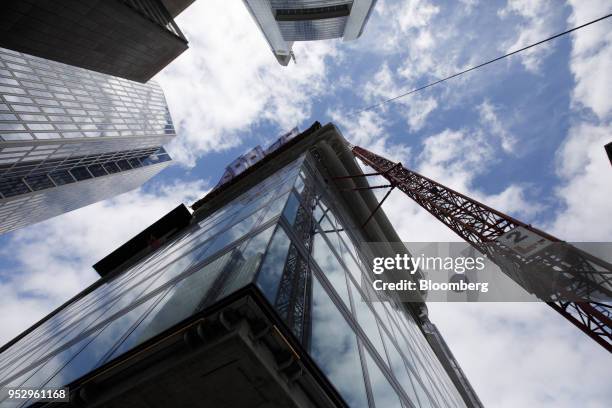 Construction crane stands beside the Omiturm mixed-use 45-story residential and office tower block, developed by Tishman Speyer Properties LP and...